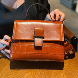Oil wax cowhide handbag